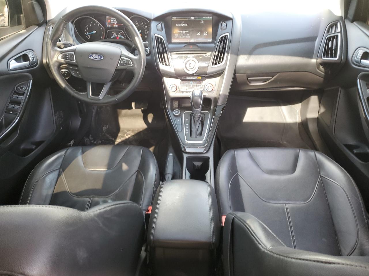 2015 Ford Focus Titanium VIN: 1FADP3J20FL260717 Lot: 81869835