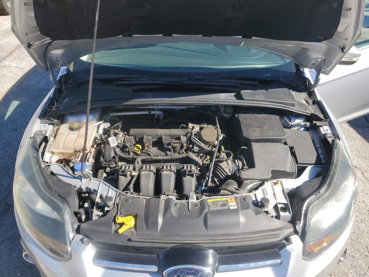2014 Ford Focus Titanium VIN: 1FADP3N22EL209180 Lot: 82577545
