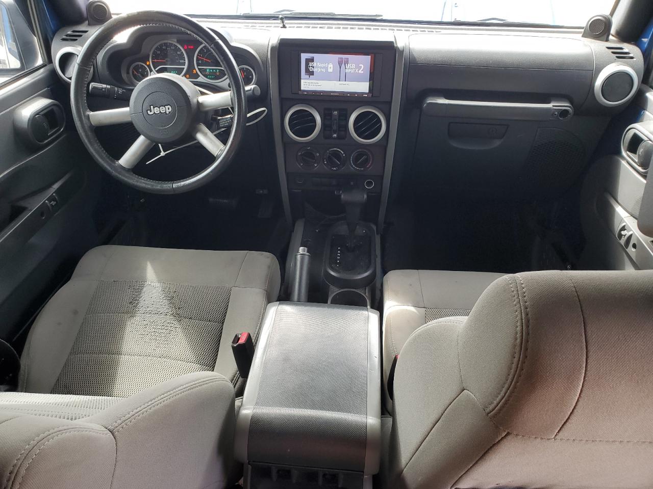 2009 Jeep Wrangler Unlimited Sahara VIN: 1J8GB59149L713277 Lot: 85342455