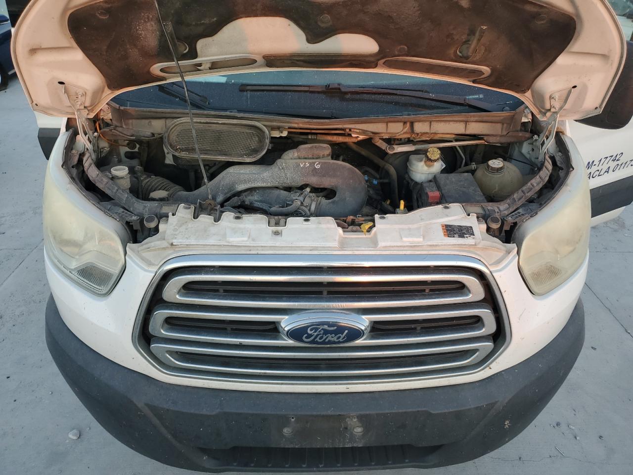 2015 Ford Transit Cargo Van T- VIN: 1FTNR1ZM0FKA35030 Lot: 82493025