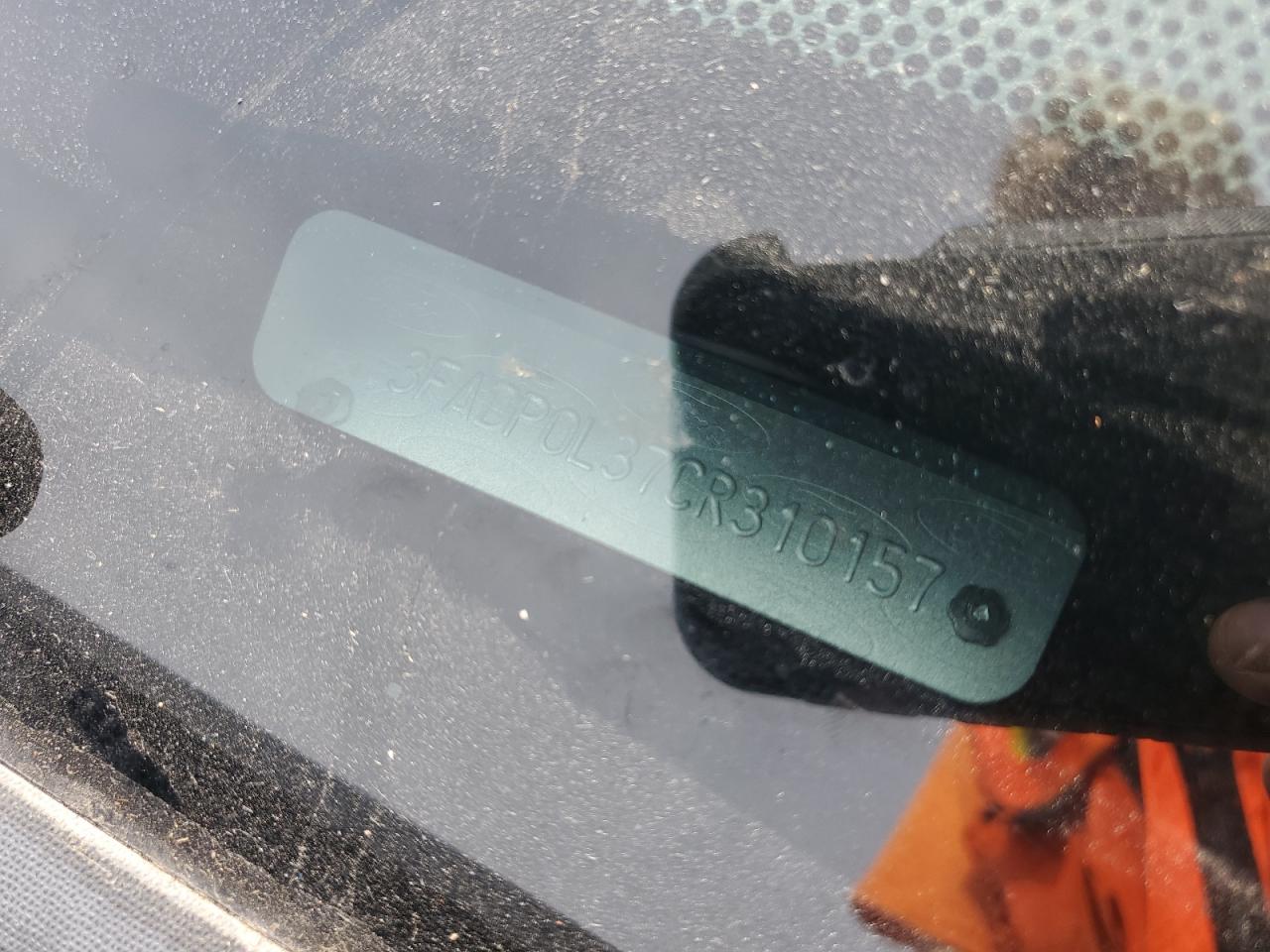 2012 Ford Fusion Hybrid VIN: 3FADP0L37CR310157 Lot: 82410355