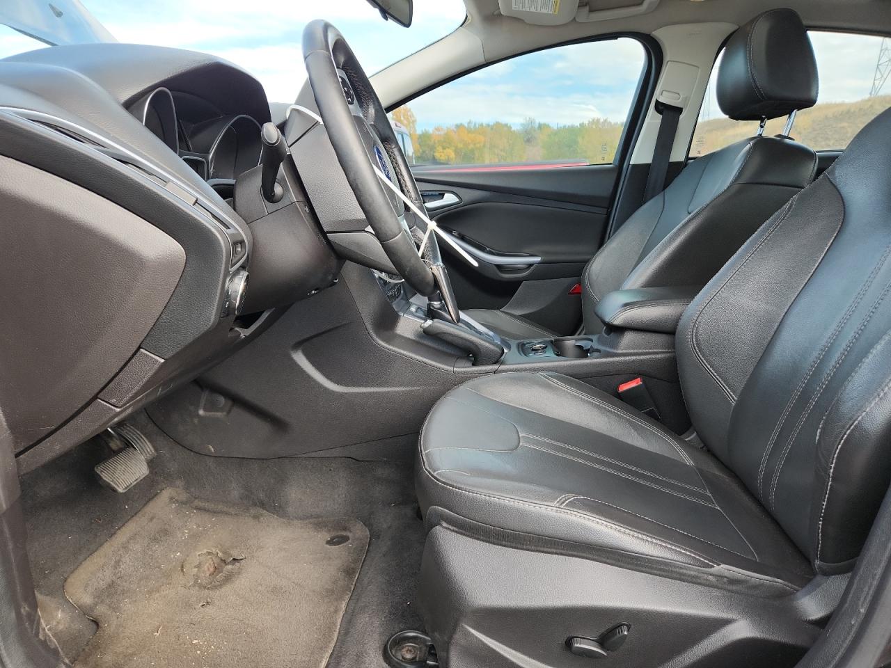 2014 Ford Focus Titanium VIN: 1FADP3J28EL224272 Lot: 86531015