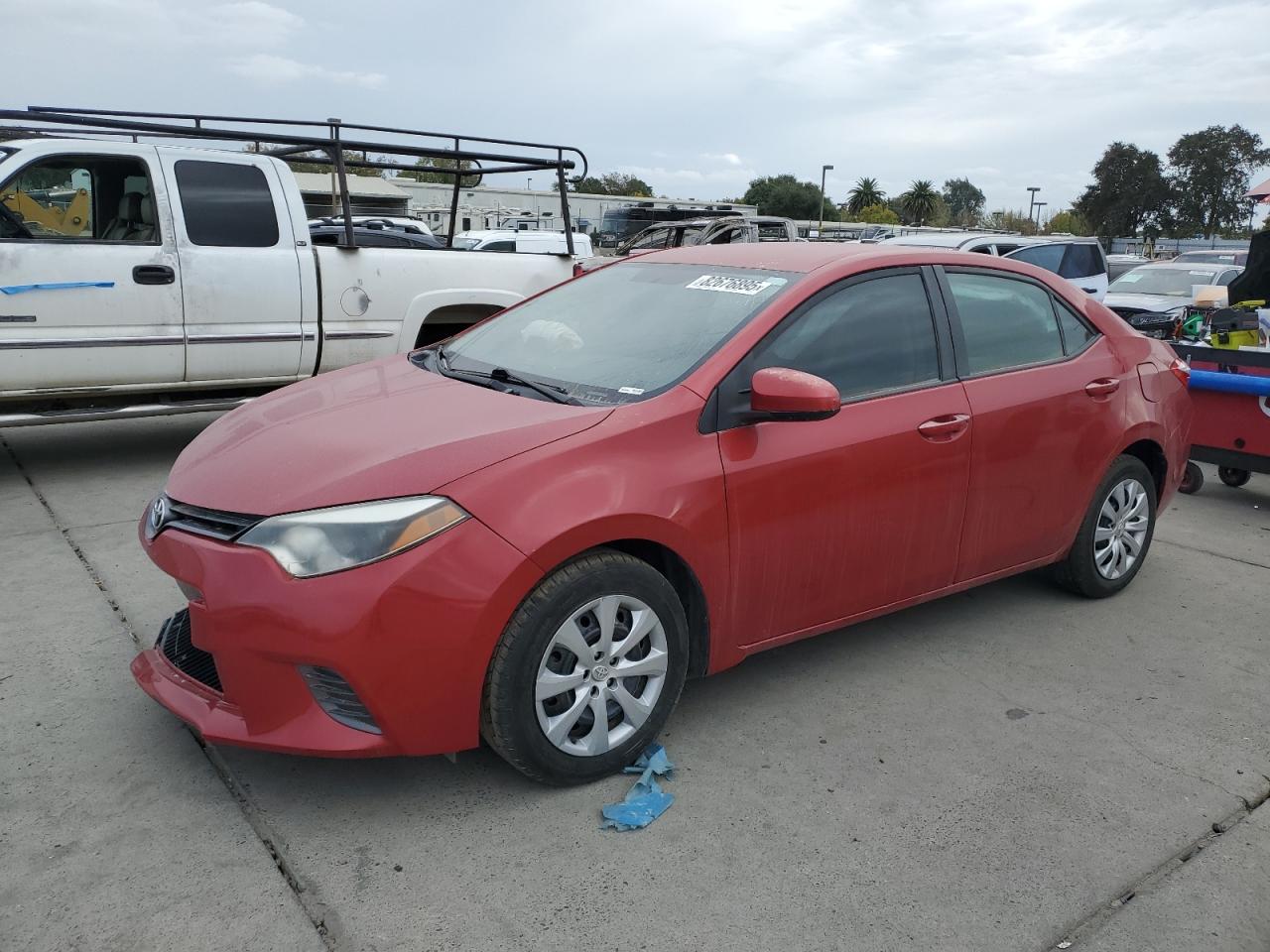 2015 Toyota Corolla L red sedan gas 5YFBURHE6FP224700 photo #1
