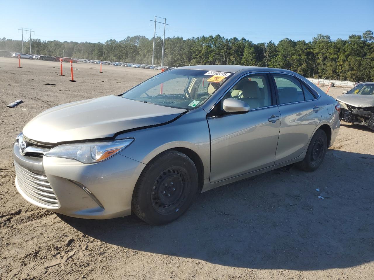 2016 Toyota Camry Le gold sedan gas 4T4BF1FK4GR559237 photo #1