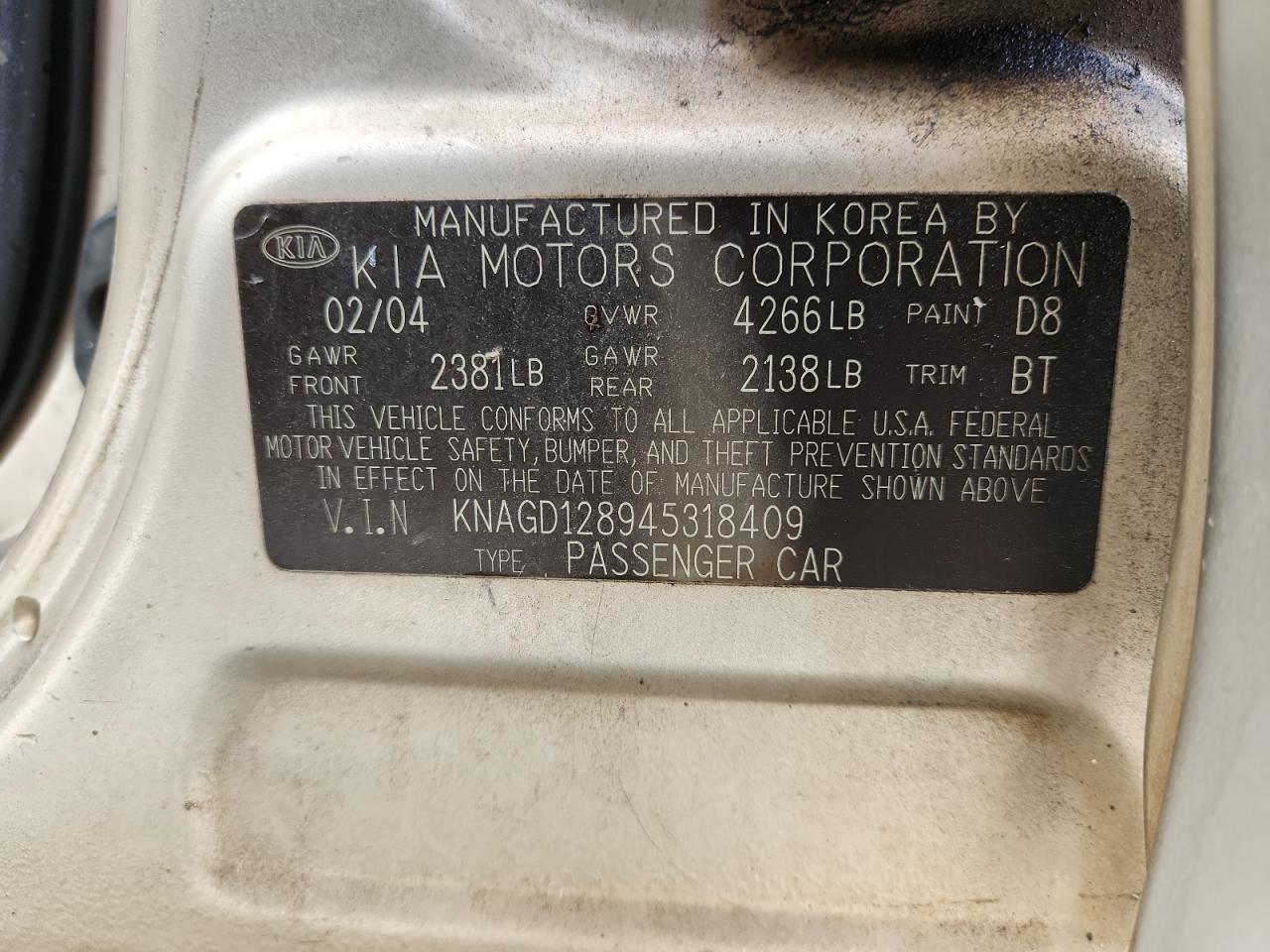 2004 Kia Optima Lx VIN: KNAGD128945318409 Lot: 85505465