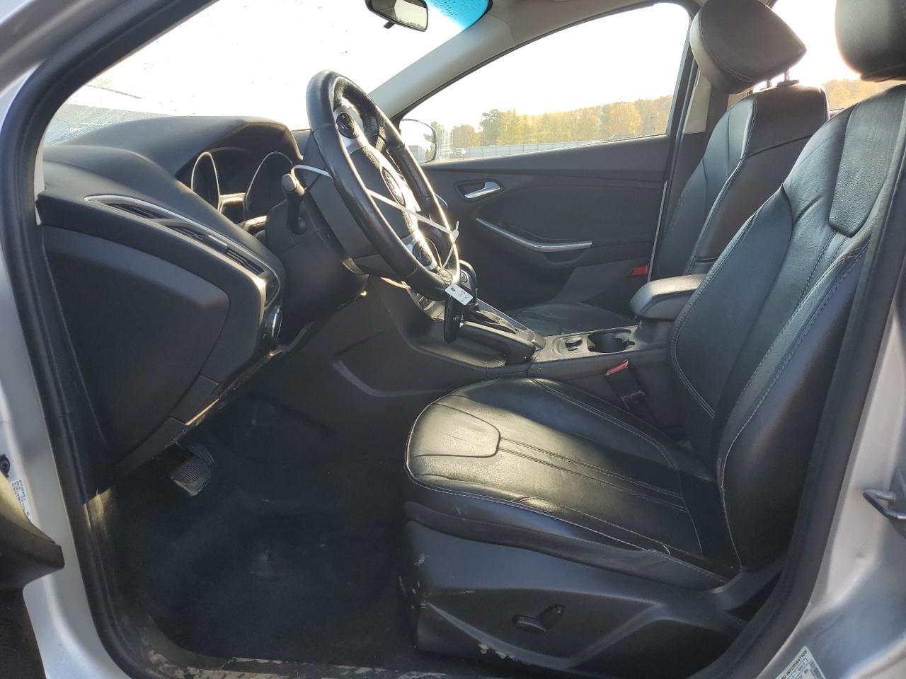 2014 Ford Focus Titanium VIN: 1FADP3J23EL280409 Lot: 82561165