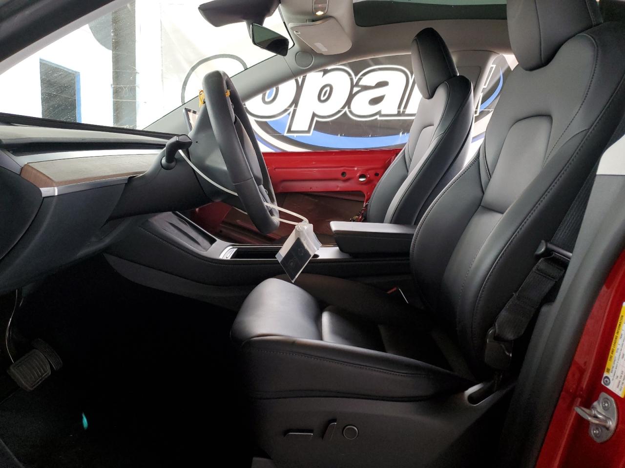 2023 Tesla Model Y VIN: 7SAYGDEE9PF715299 Lot: 82559315