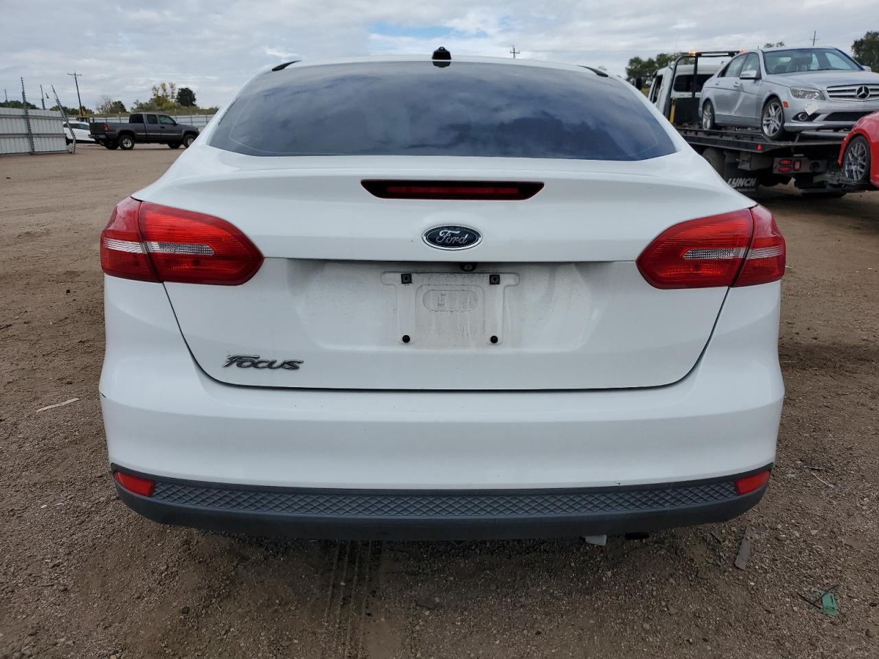 2015 Ford Focus S VIN: 1FADP3E24FL221235 Lot: 82374575