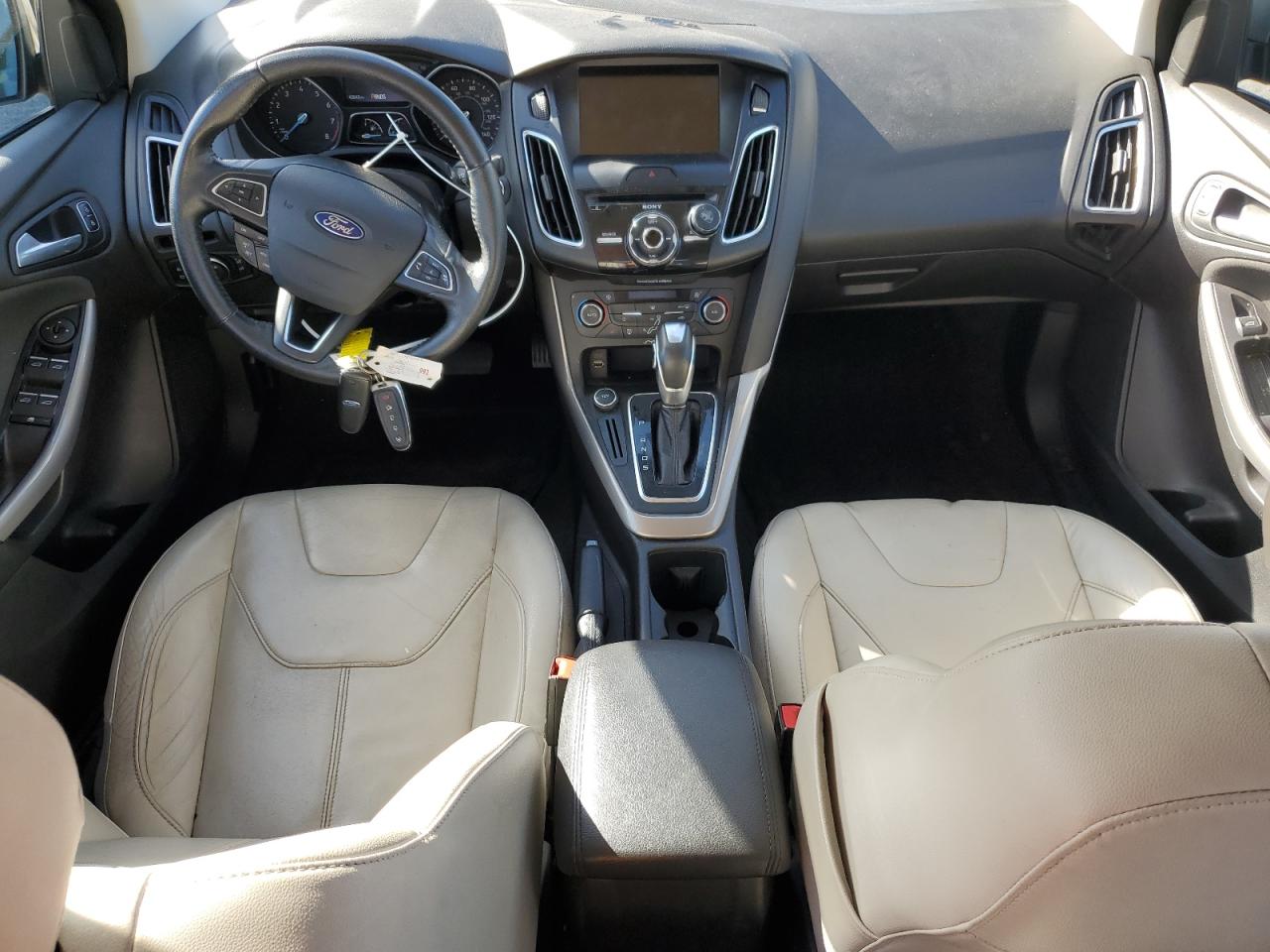 2015 Ford Focus Titanium VIN: 1FADP3J2XFL226736 Lot: 84420675