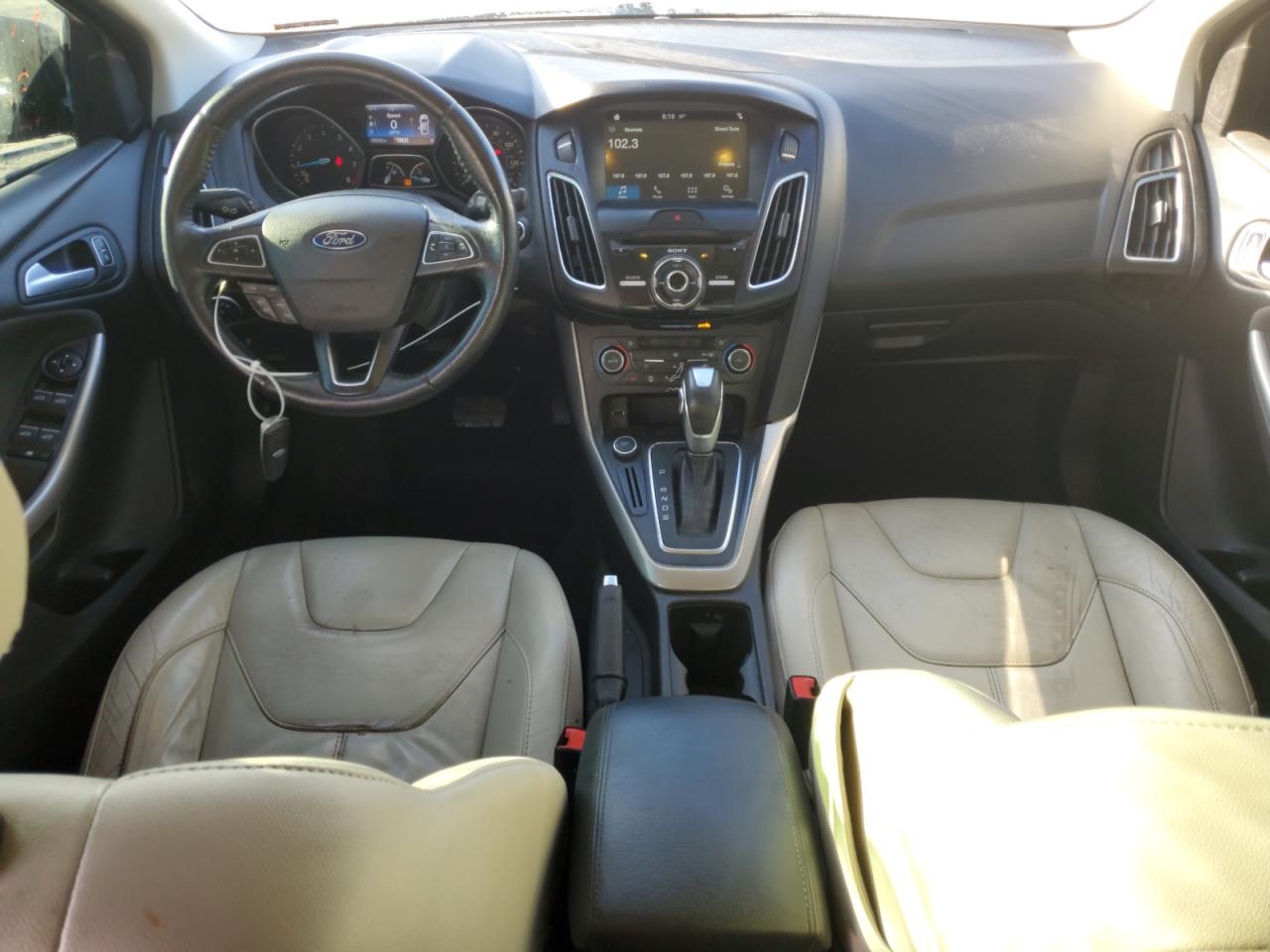 2016 Ford Focus Titanium VIN: 1FADP3J21GL245807 Lot: 85719655