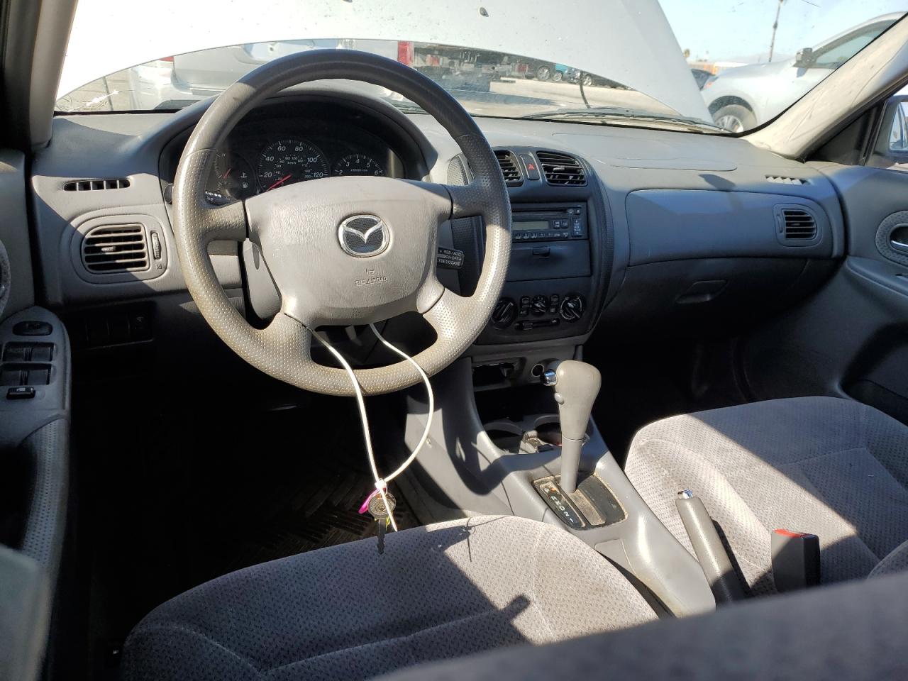 2000 Mazda Protege Dx VIN: JM1BJ2229Y0240207 Lot: 89847325