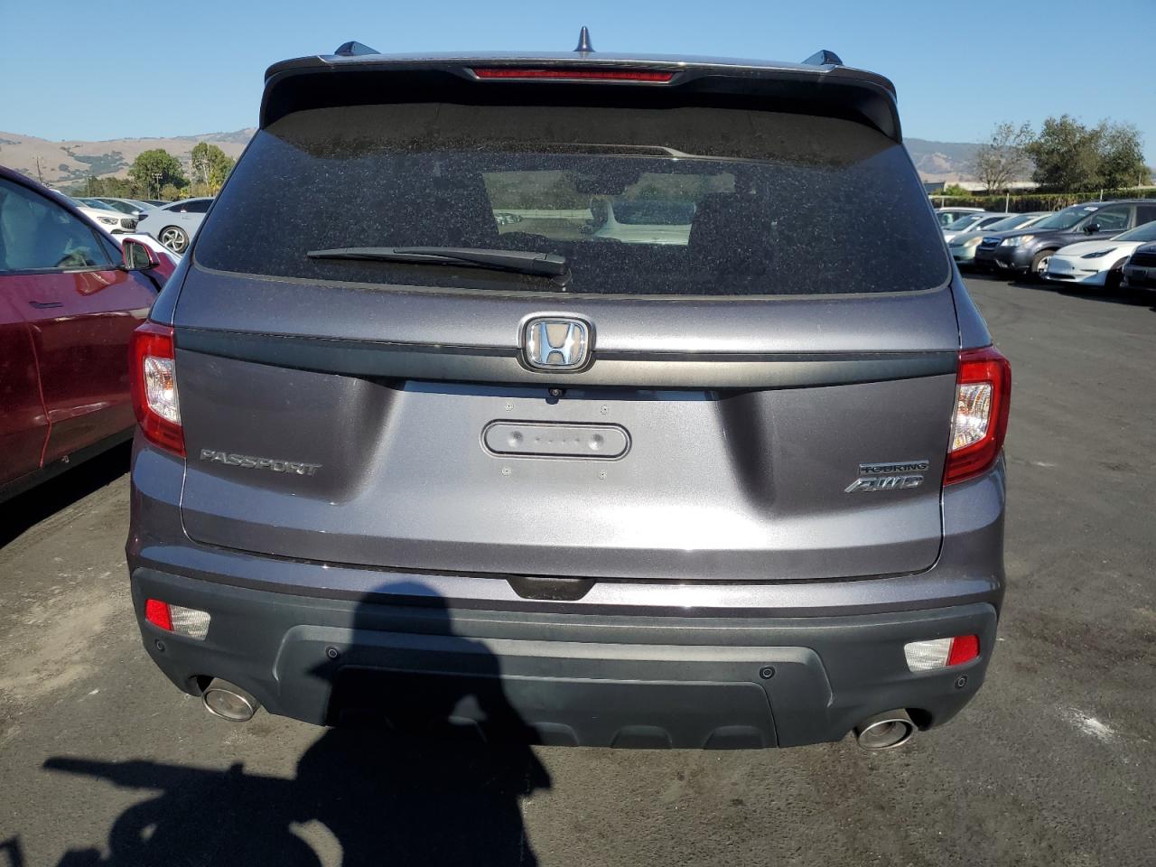 2021 Honda Passport Touring VIN: 5FNYF8H99MB009158 Lot: 82323845
