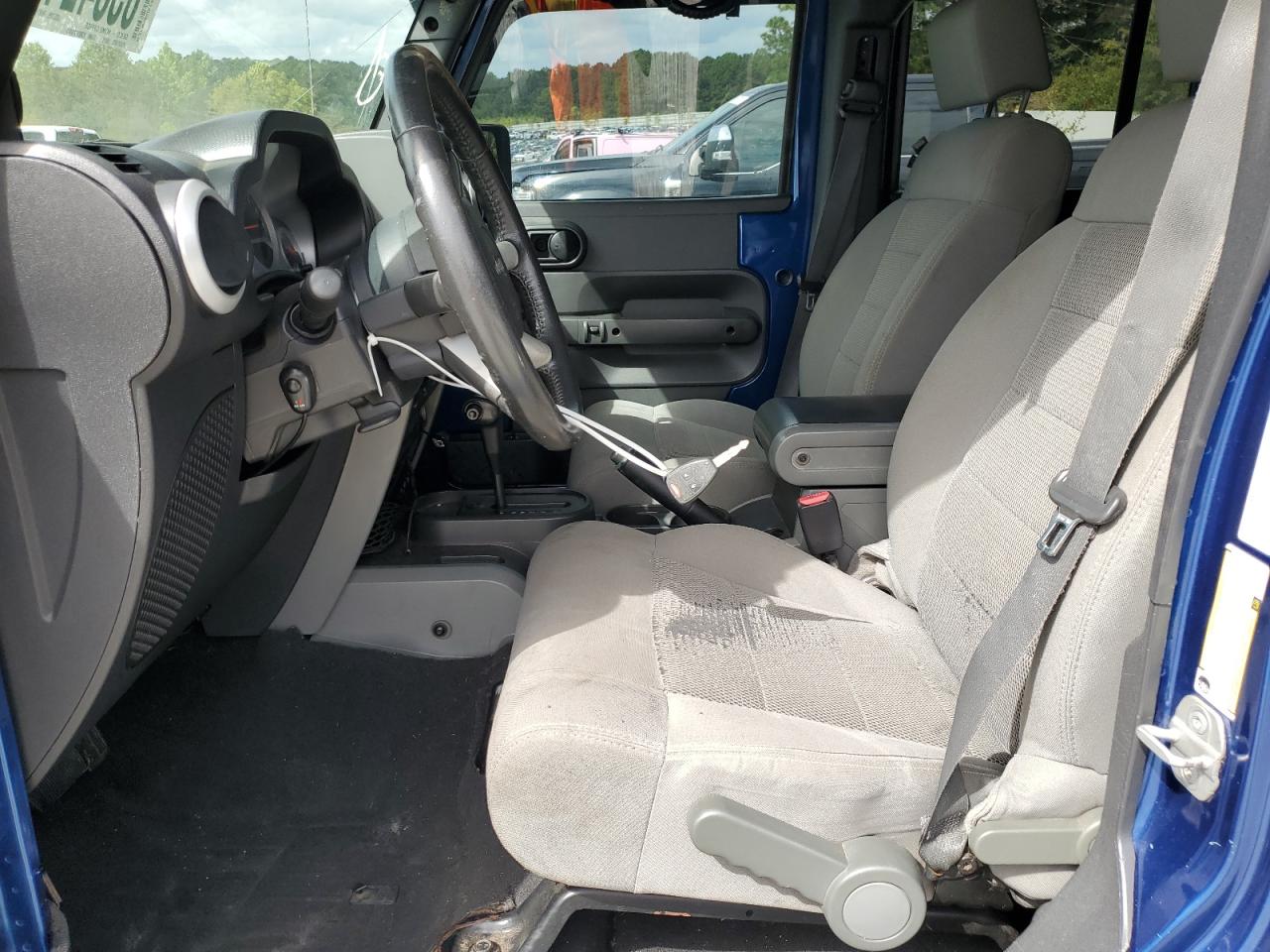 2009 Jeep Wrangler Unlimited Sahara VIN: 1J8GB59149L713277 Lot: 85342455