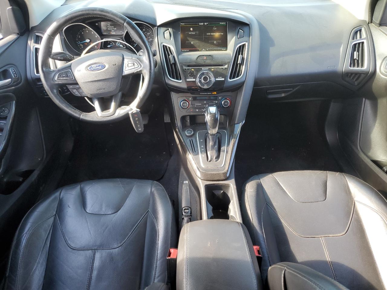 2015 Ford Focus Titanium VIN: 1FADP3J24FL387048 Lot: 82431245