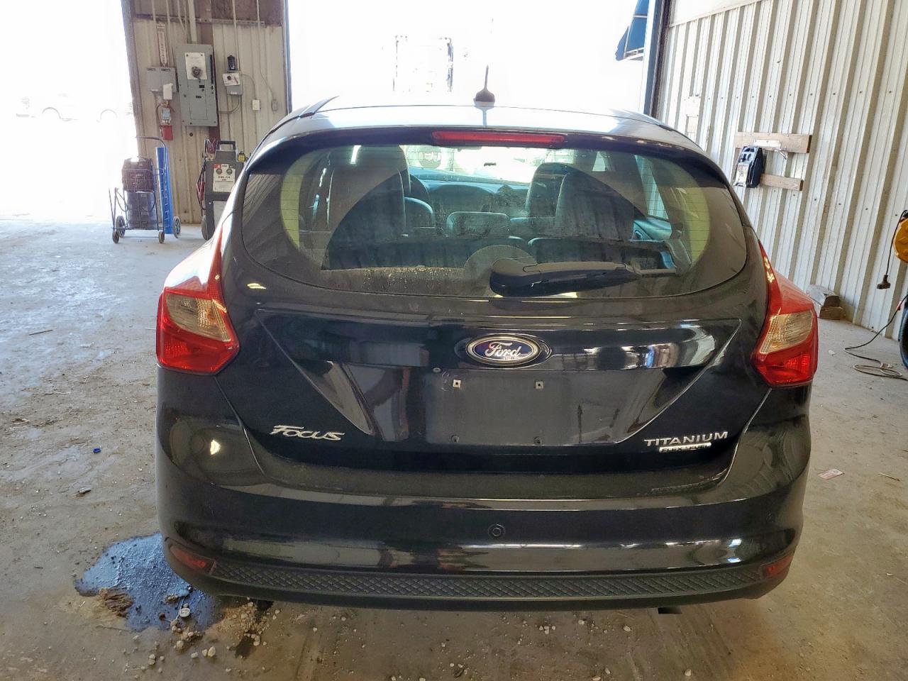 2014 Ford Focus Titanium VIN: 1FADP3N23EL192924 Lot: 85731195