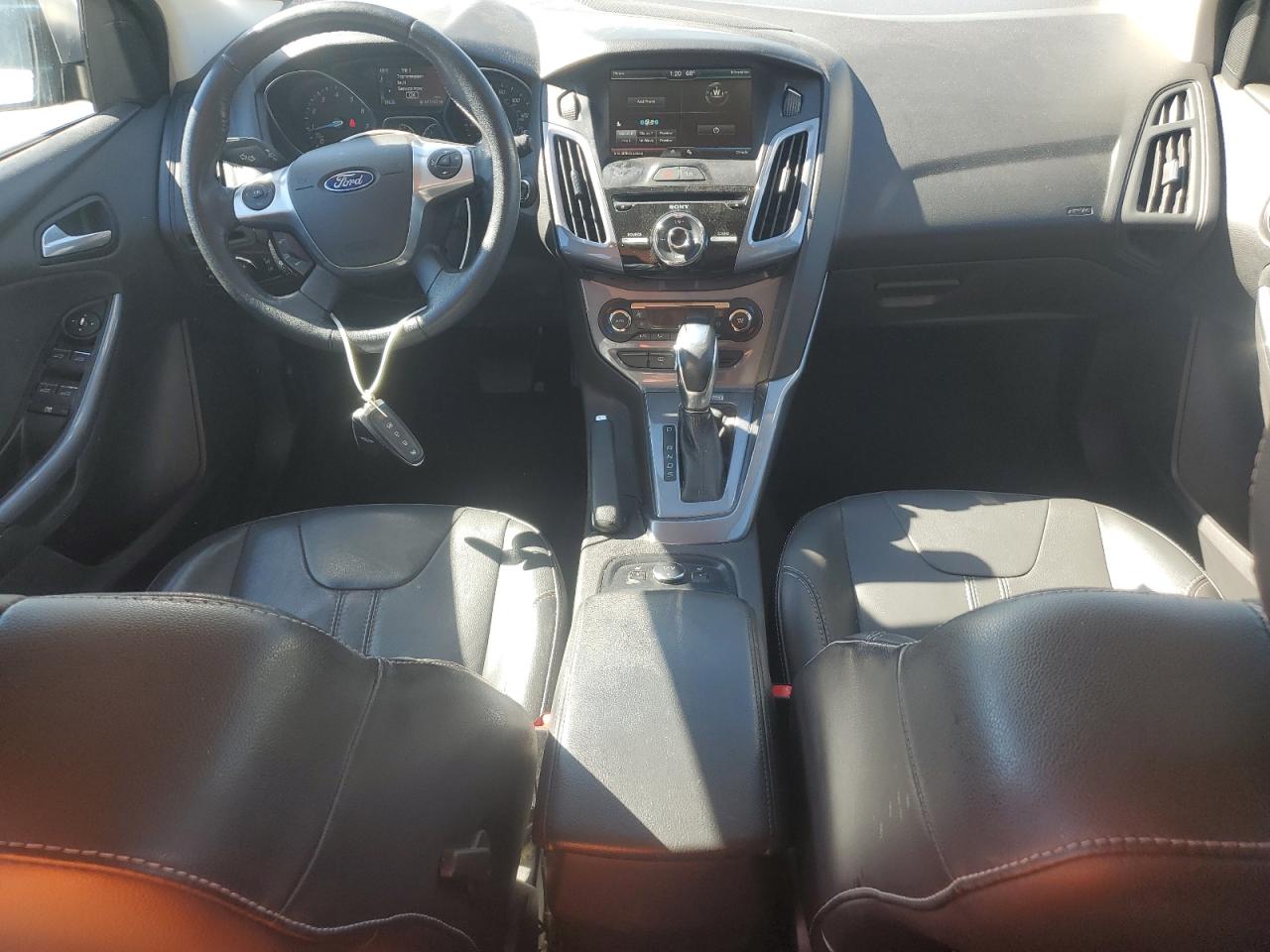 2014 Ford Focus Titanium VIN: 1FADP3N22EL209180 Lot: 82577545