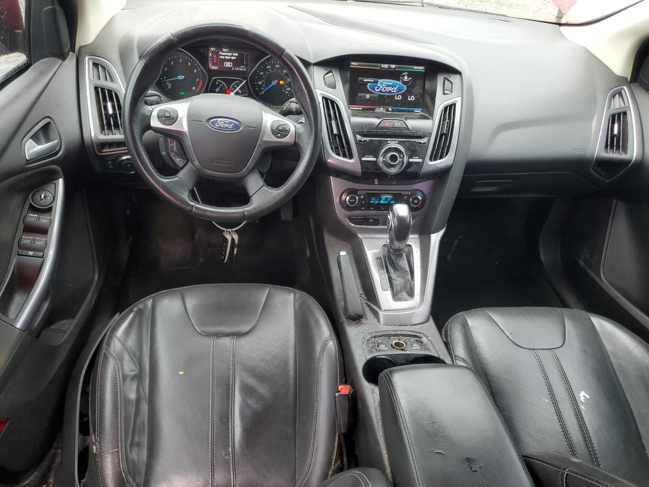 2014 Ford Focus Titanium VIN: 1FADP3N25EL380733 Lot: 84982525
