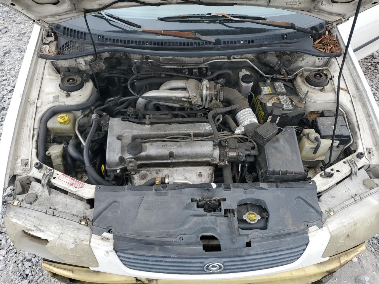 1996 Mazda Protege Dx VIN: JM1BB1411T0333839 Lot: 82264215