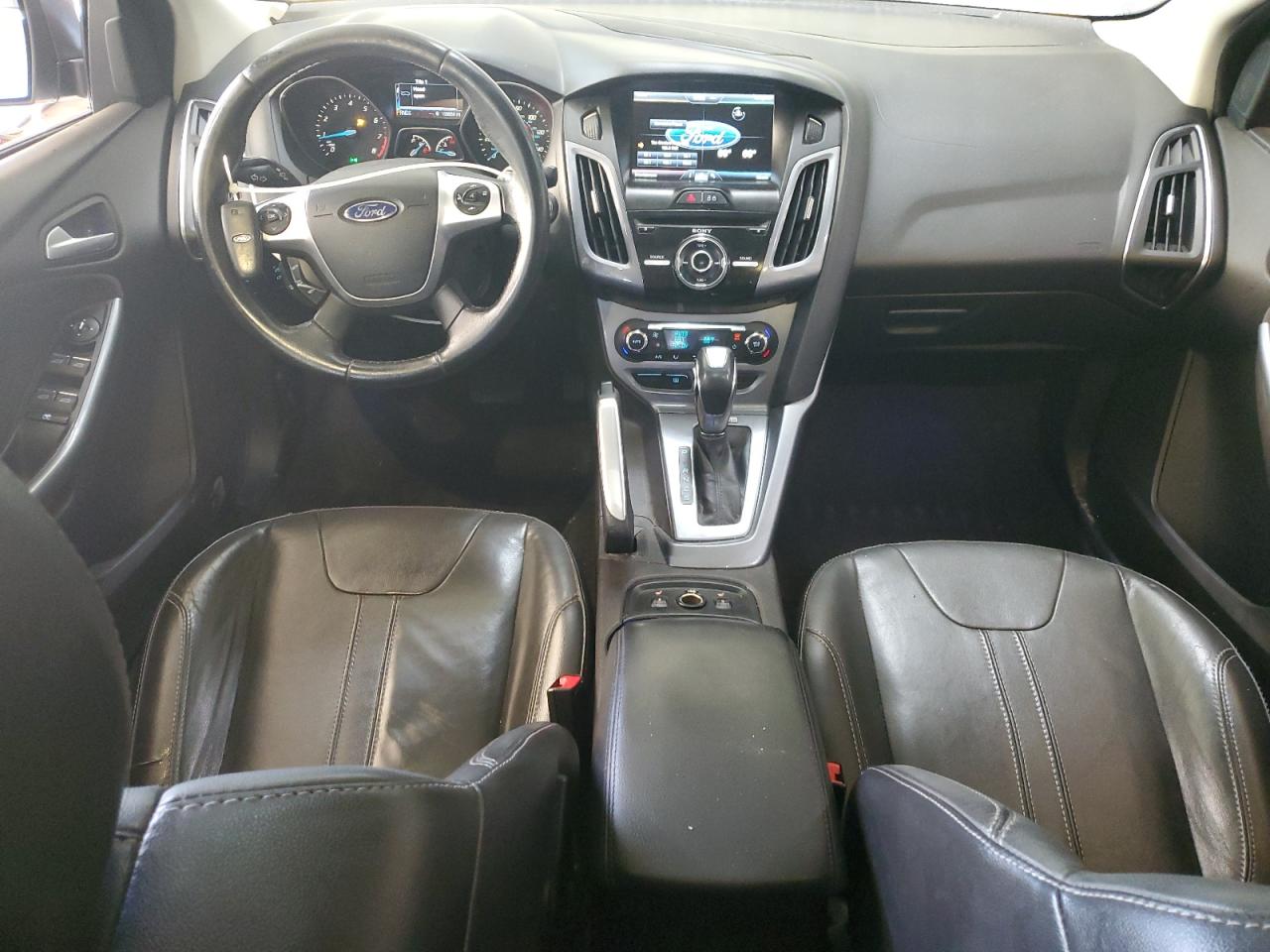 2014 Ford Focus Titanium VIN: 1FADP3J21EL121002 Lot: 84613095