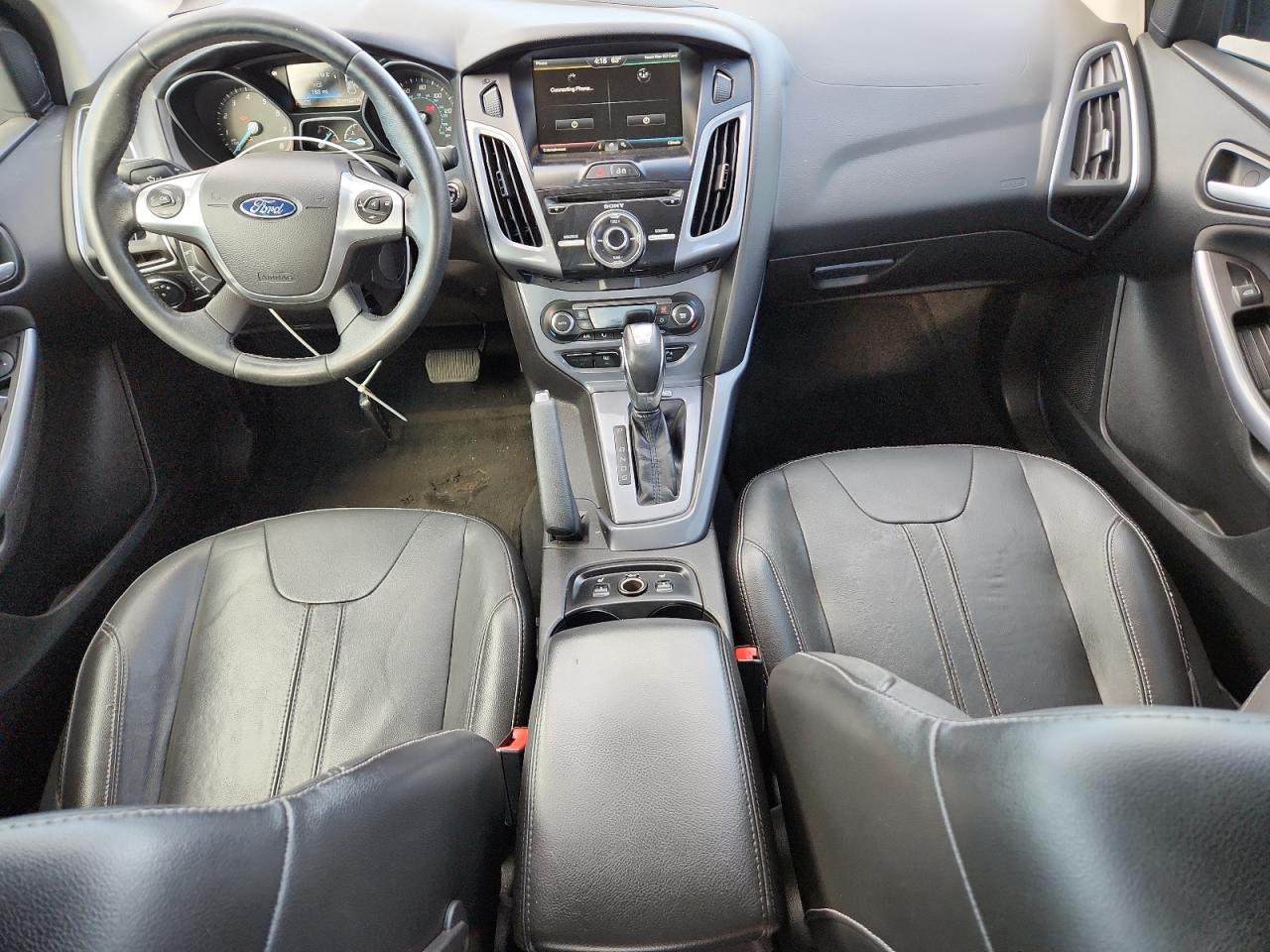 2014 Ford Focus Titanium VIN: 1FADP3J28EL224272 Lot: 86531015