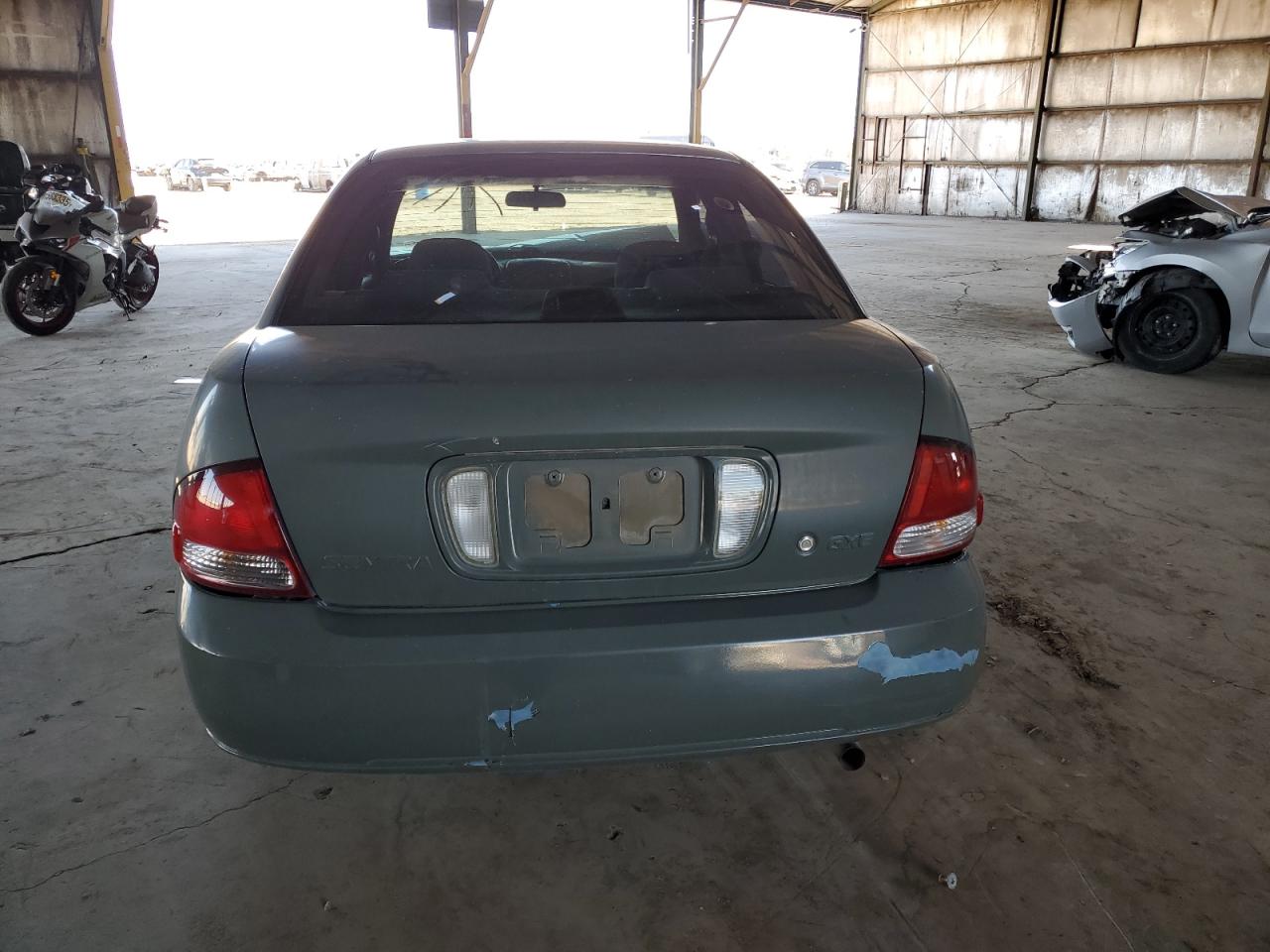 2003 Nissan Sentra Xe VIN: 3N1CB51D33L706556 Lot: 85144025