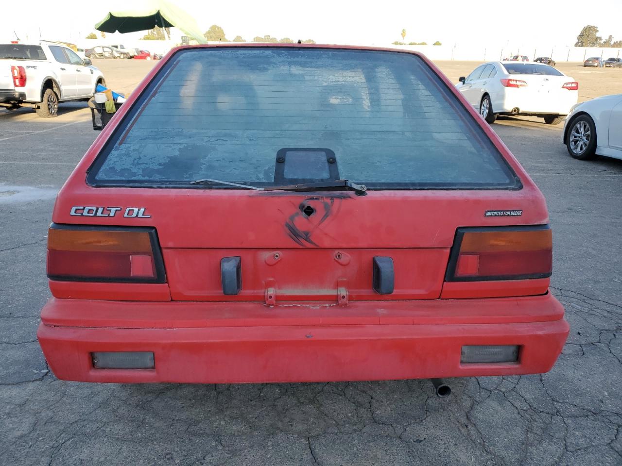 1988 Dodge Colt Dl VIN: JB3BA34K9JU080994 Lot: 84350235