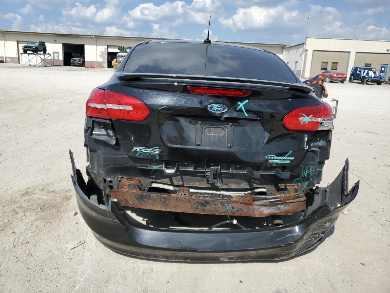 2015 Ford Focus Titanium VIN: 1FADP3J20FL260717 Lot: 81869835