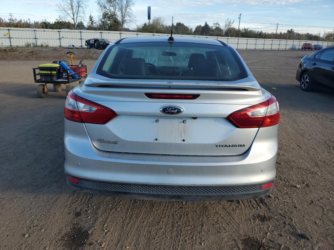 2014 Ford Focus Titanium VIN: 1FADP3J23EL280409 Lot: 82561165