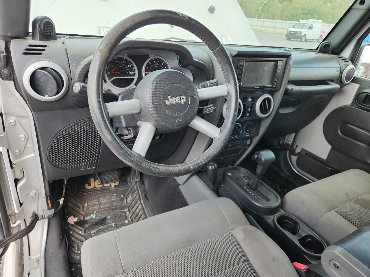 2009 Jeep Wrangler Unlimited Sahara VIN: 1J8GA59129L752033 Lot: 82254955