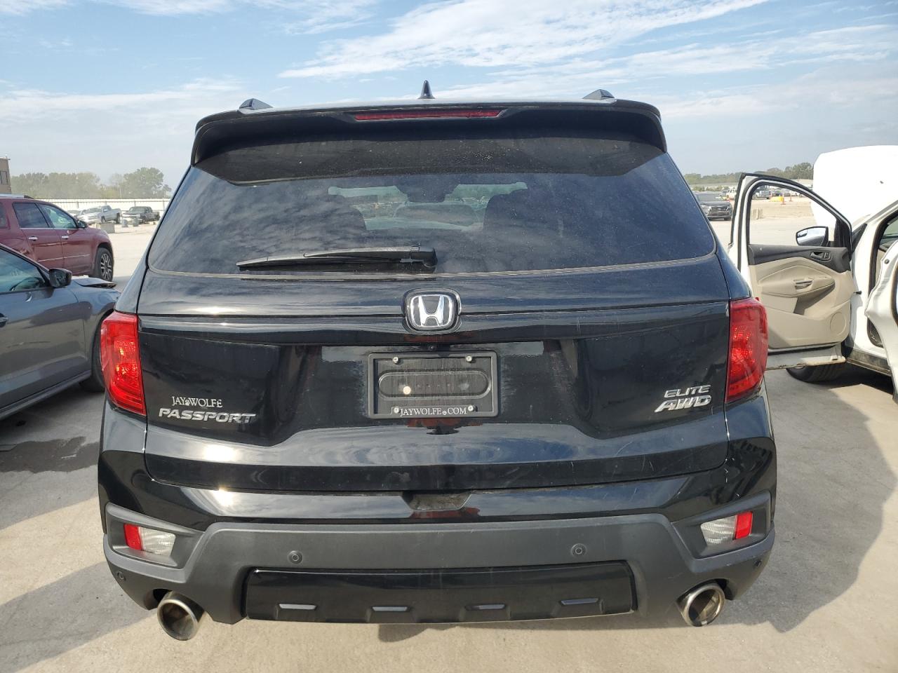2022 Honda Passport Elite VIN: 5FNYF8H04NB000290 Lot: 87049905