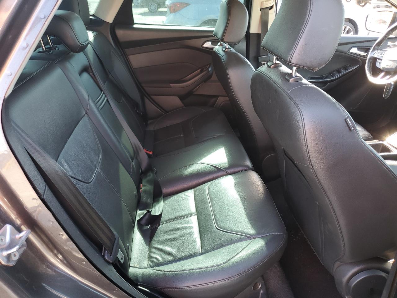 2015 Ford Focus Titanium VIN: 1FADP3J24FL387048 Lot: 82431245