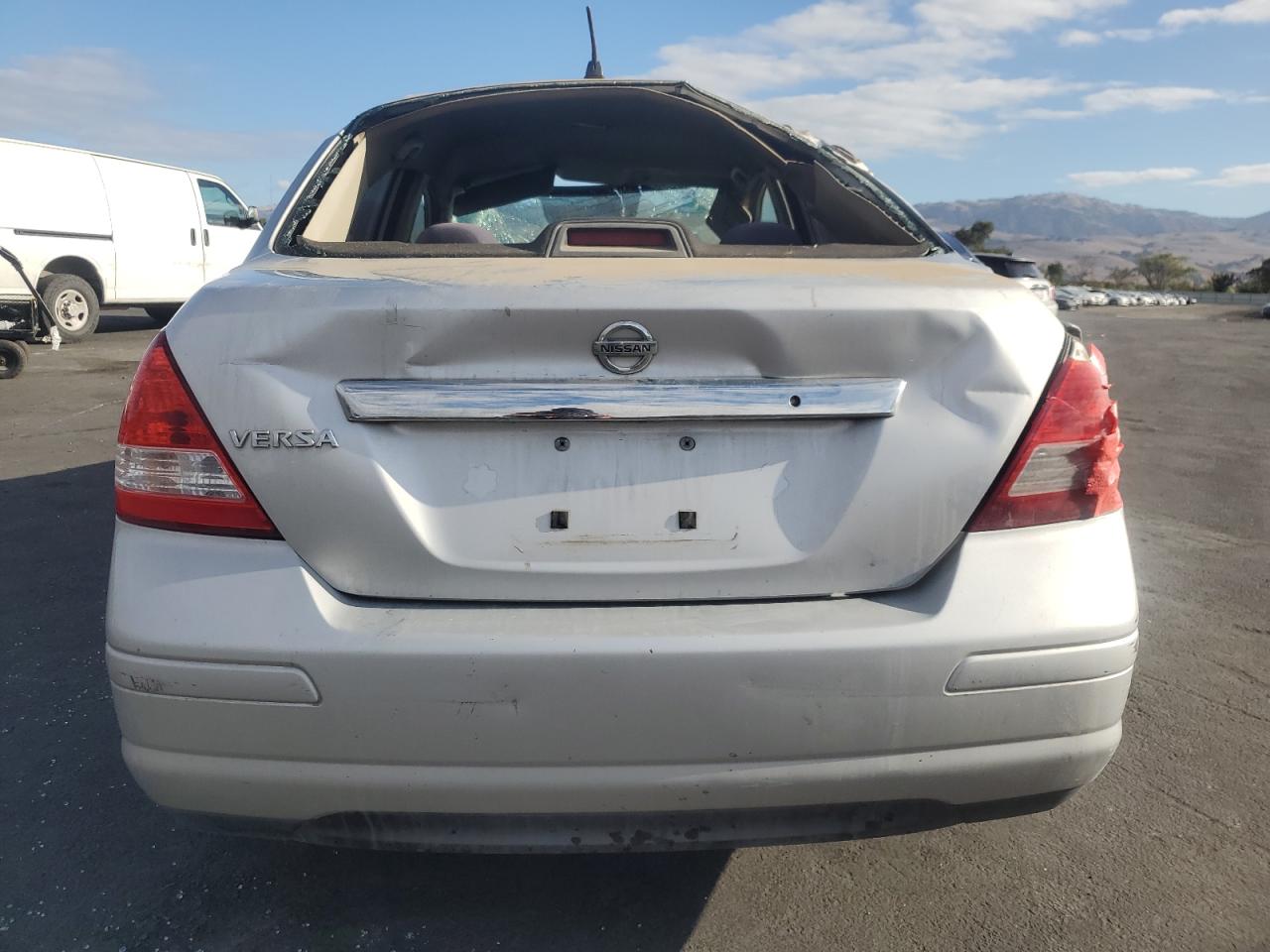 2009 Nissan Versa S VIN: 3N1BC11E09L396725 Lot: 82294335