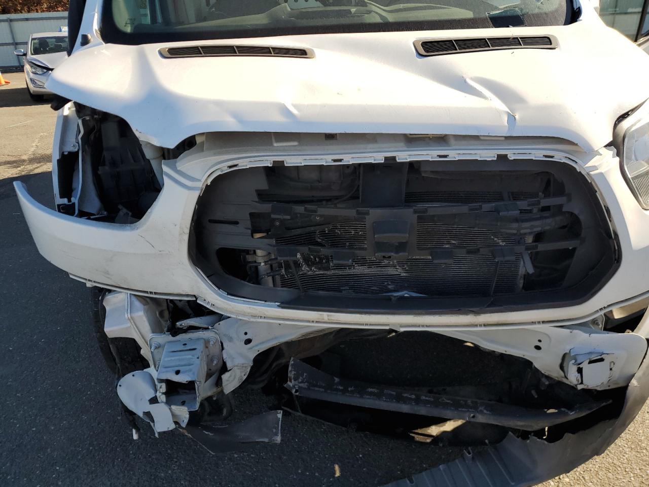 2018 Ford Transit T-150 VIN: 1FTYE2CMXJKA12144 Lot: 86290205