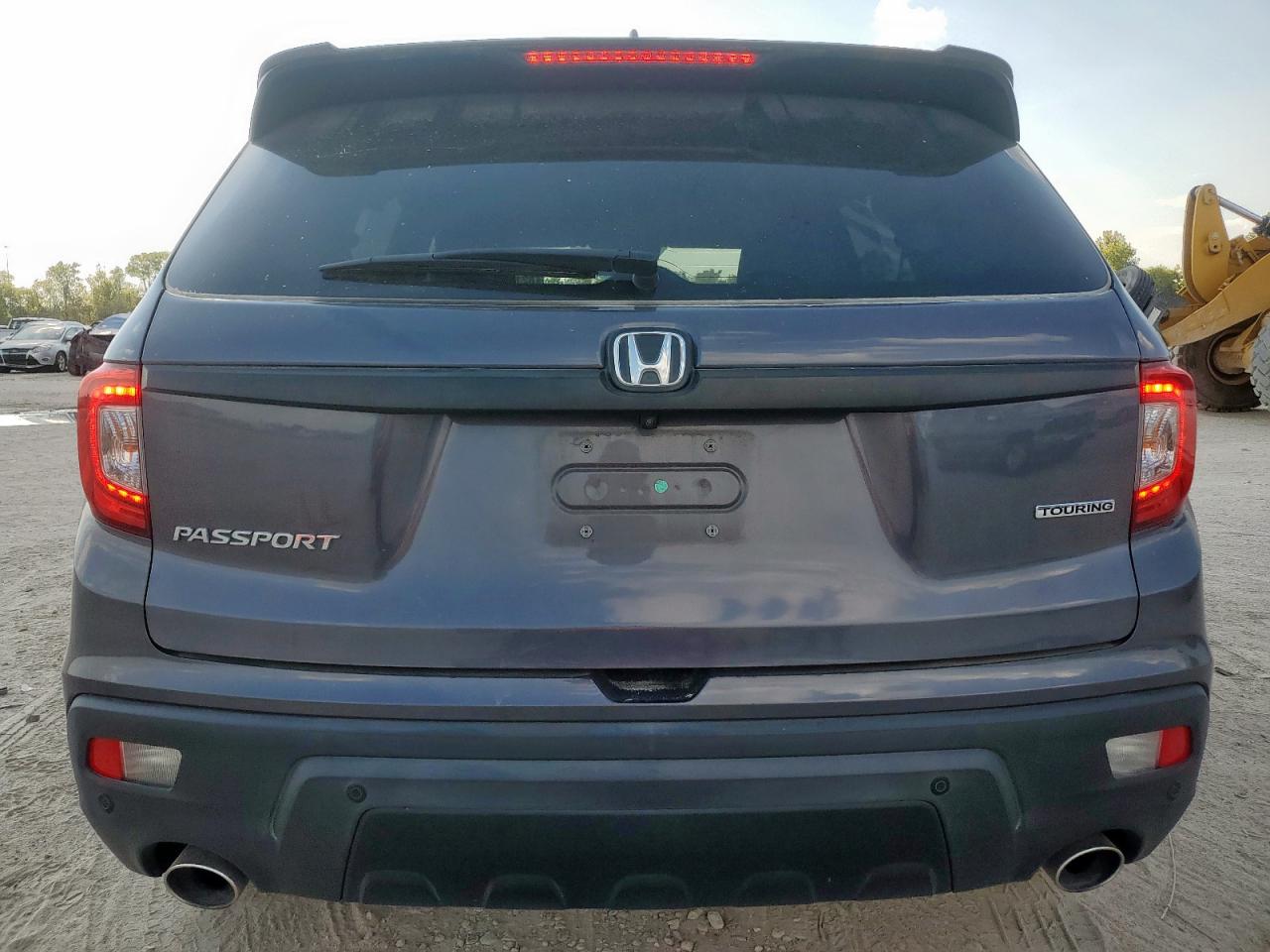 2021 Honda Passport Touring VIN: 5FNYF7H98MB010750 Lot: 82175355