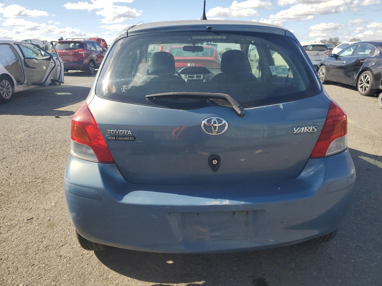 2009 Toyota Yaris VIN: JTDKT903X95232992 Lot: 90540085