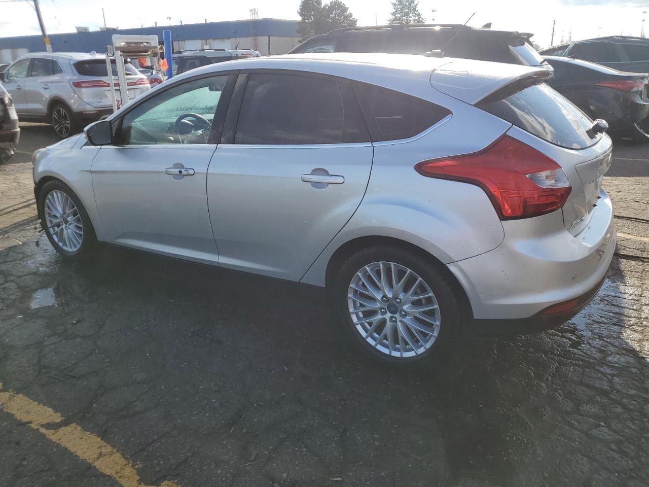 2014 Ford Focus Titanium VIN: 1FADP3N26EL194599 Lot: 79344684