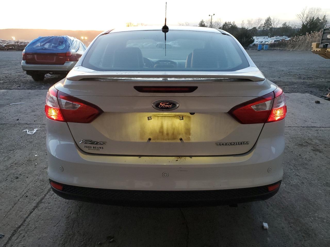 2013 Ford Focus Titanium VIN: 1FADP3J24DL330491 Lot: 80651964