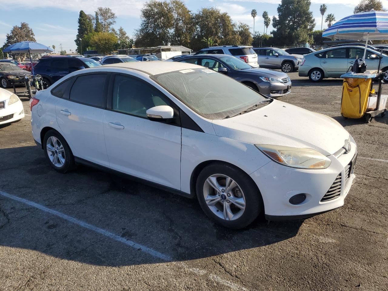 VIN 1FADP3F28EL399646 2014 FORD FOCUS no.4