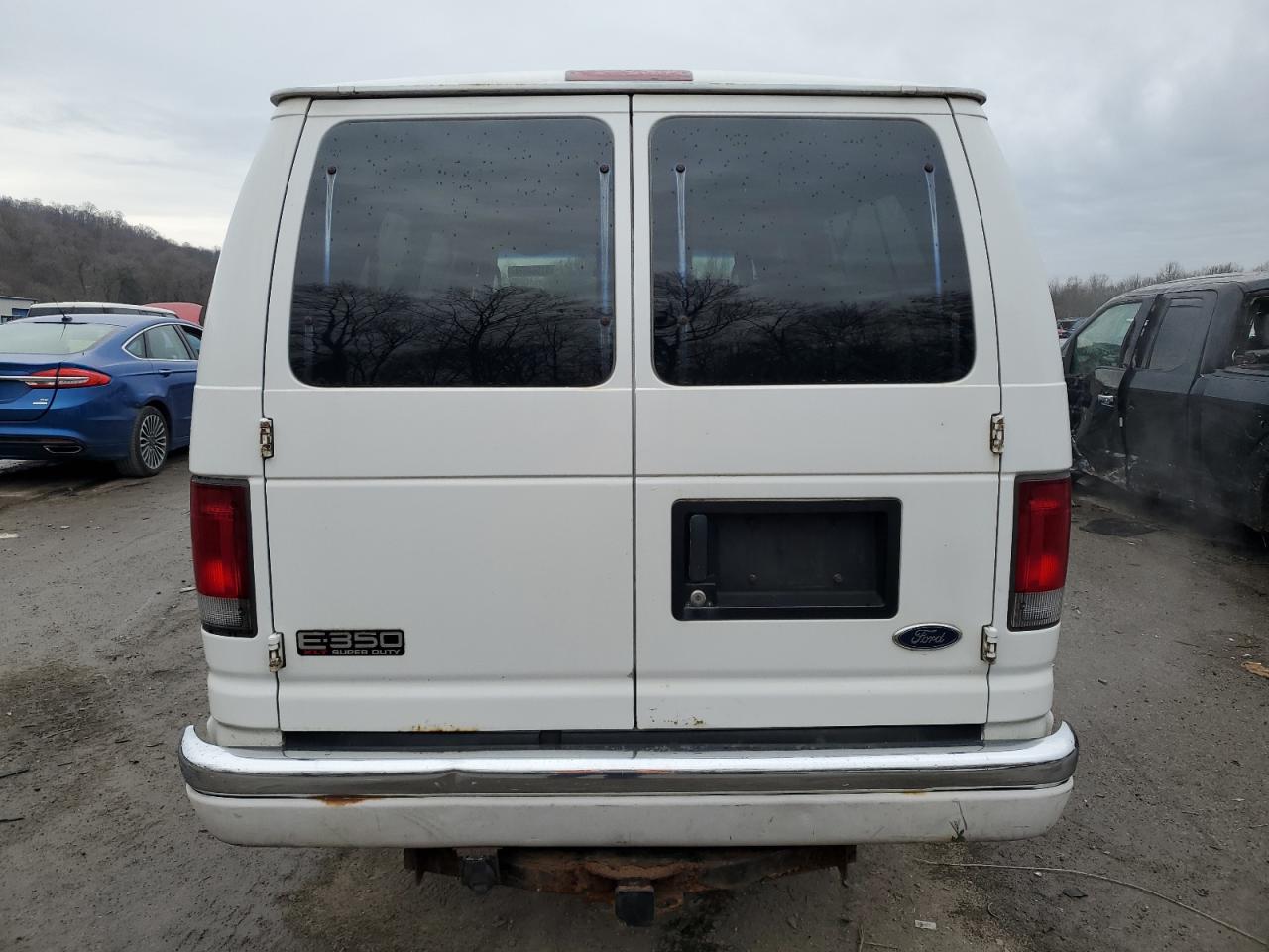 2004 Ford Econoline E350 Super Duty Wagon VIN: 1FBSS31L64HA57005 Lot: 81564974