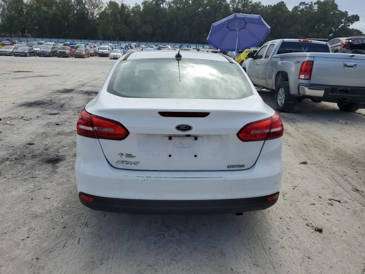 2015 Ford Focus S VIN: 1FADP3E24FL270418 Lot: 79724414