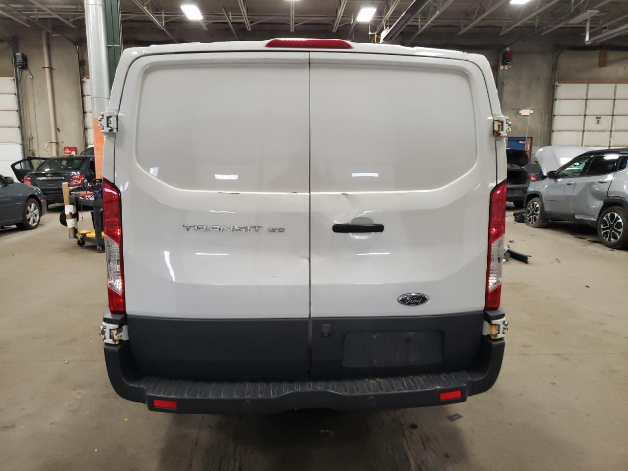 2015 Ford Transit T-150 VIN: 1FTYE1ZM3FKA96574 Lot: 79773624