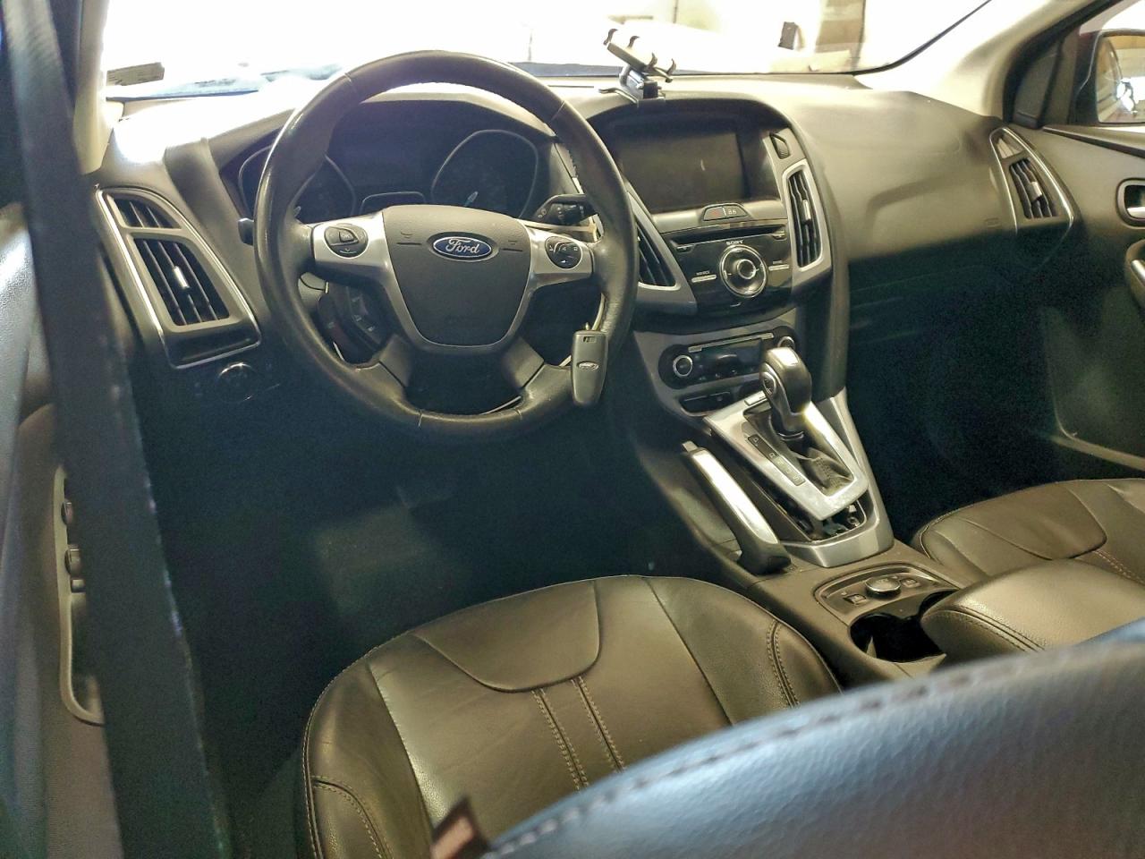 2014 Ford Focus Titanium VIN: 1FADP3J21EL104555 Lot: 94119355