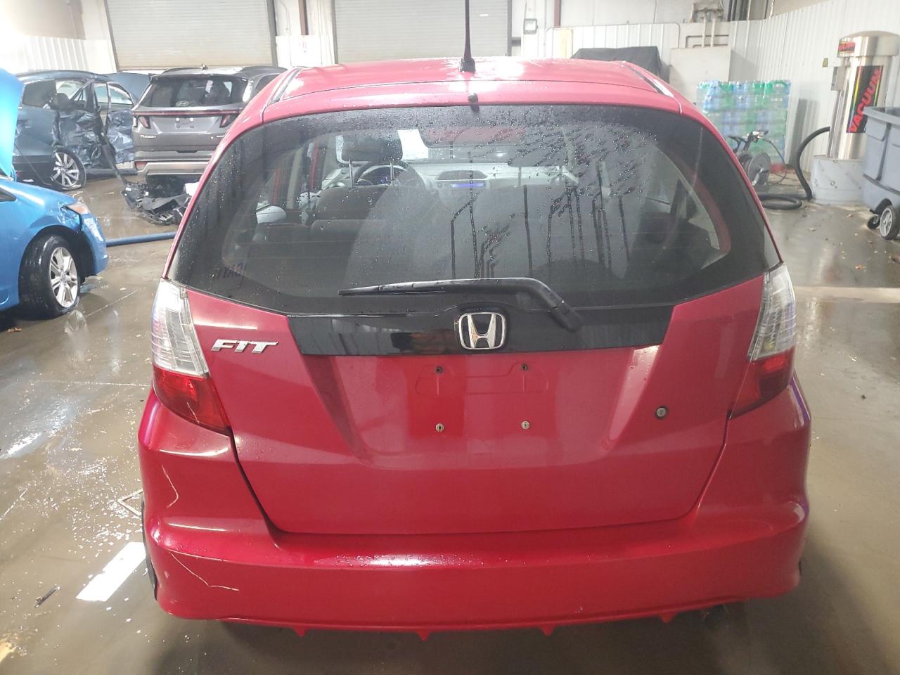 2009 Honda Fit VIN: JHMGE88219S025929 Lot: 93420675