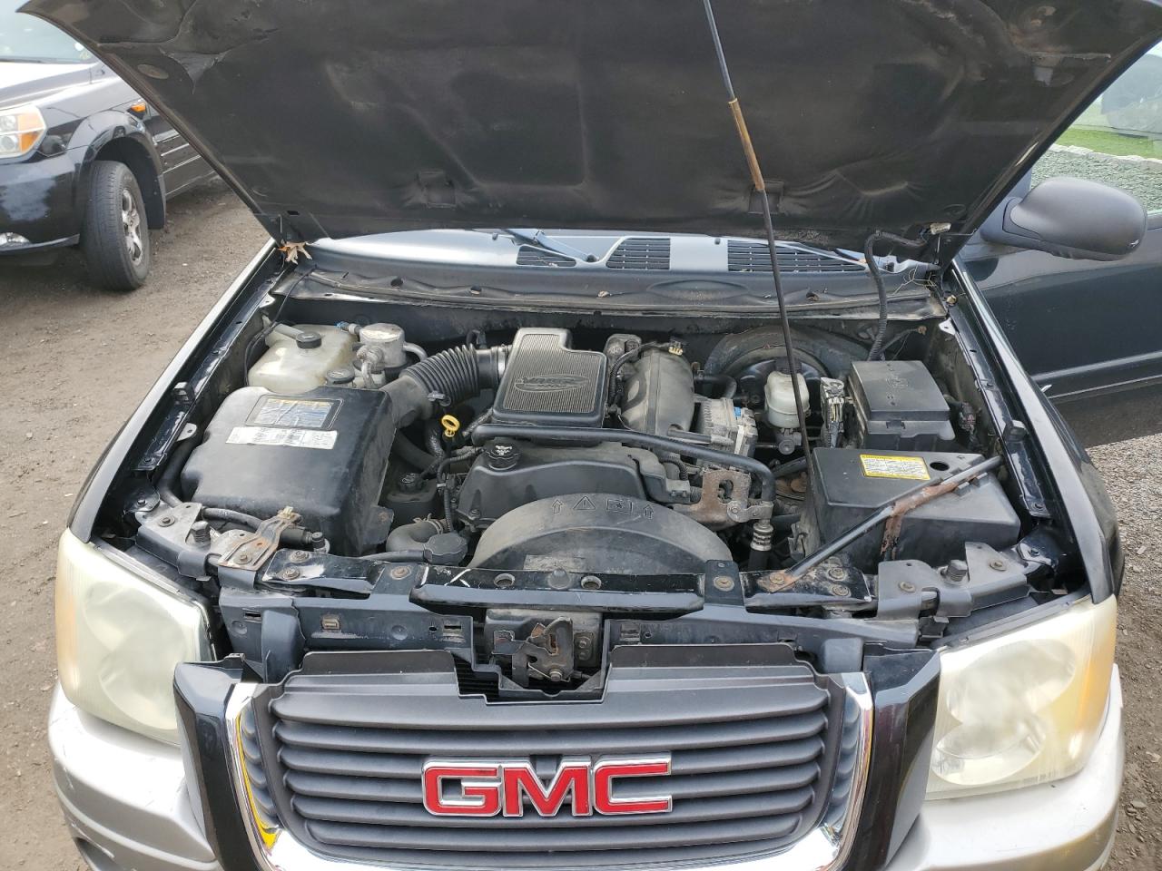 2003 GMC Envoy VIN: 1GKDT13SX32113477 Lot: 90837585