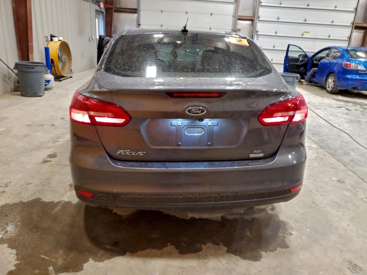 2018 Ford Focus Se VIN: 1FADP3FE6JL260989 Lot: 94250735