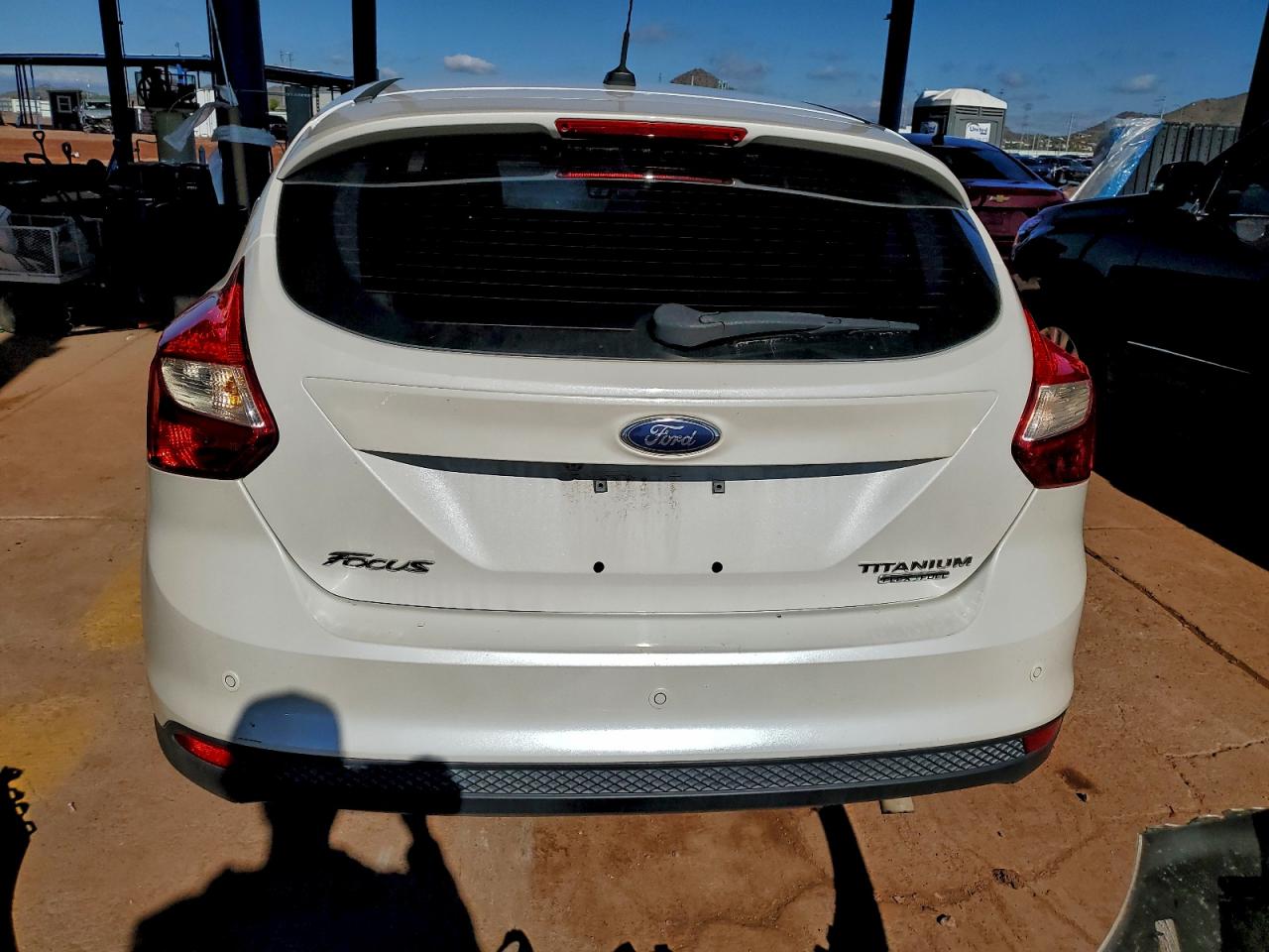 2014 Ford Focus Titanium VIN: 1FADP3N27EL382371 Lot: 93679745