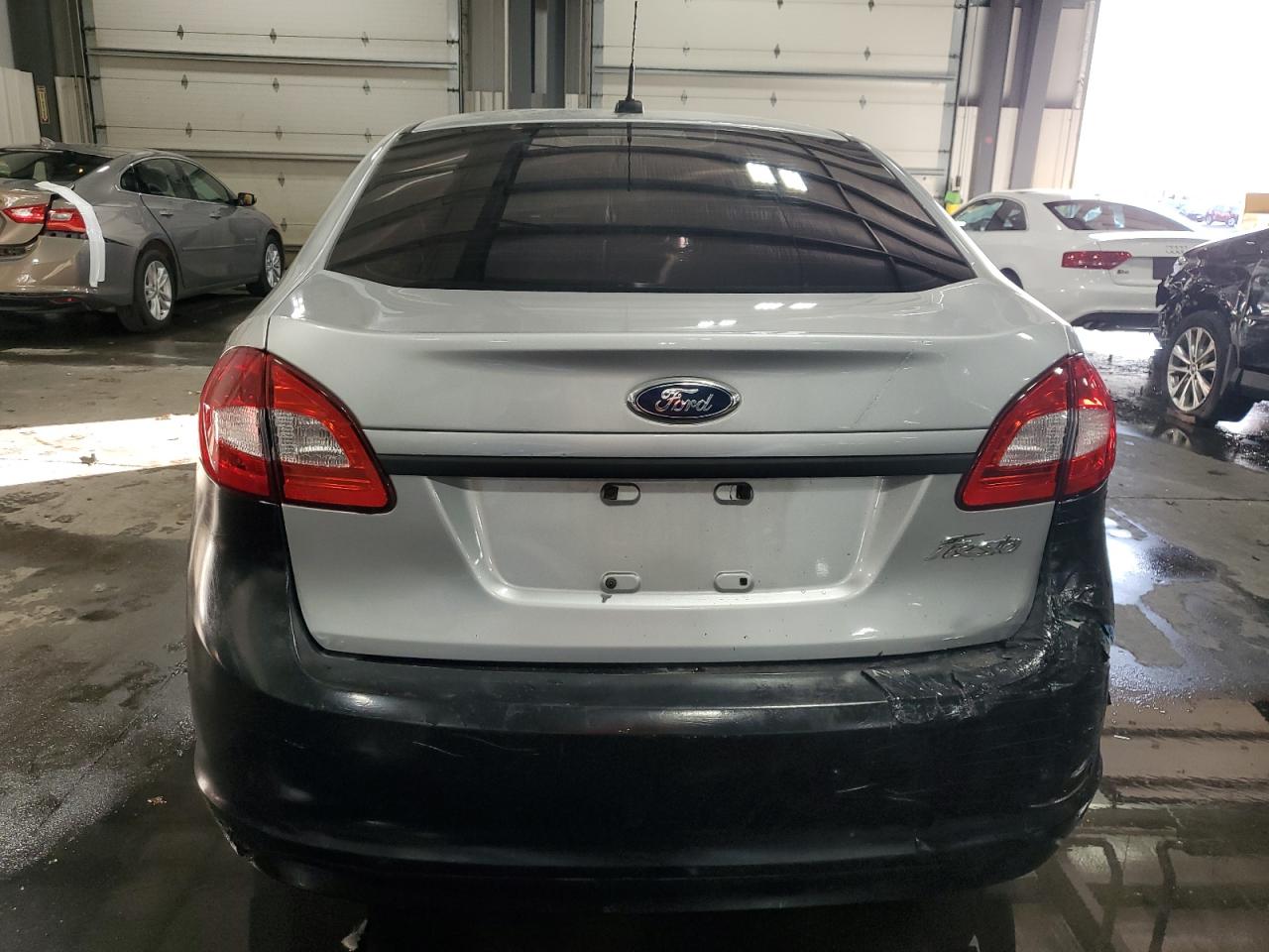 2011 Ford Fiesta S VIN: 3FADP4AJ5BM154236 Lot: 92202405