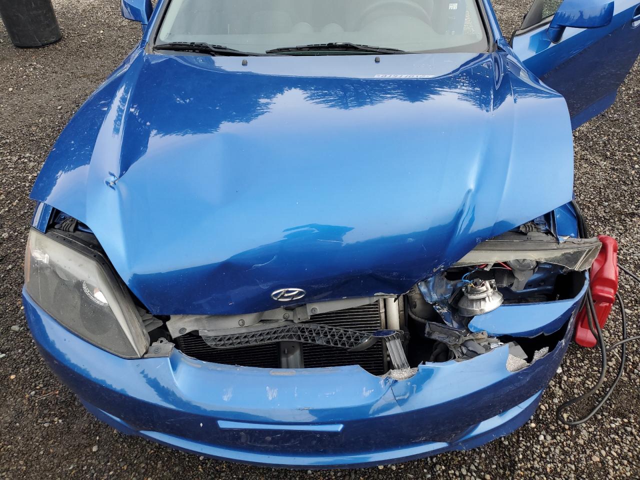 2005 Hyundai Tiburon VIN: KMHHM65DX5U168083 Lot: 91311075