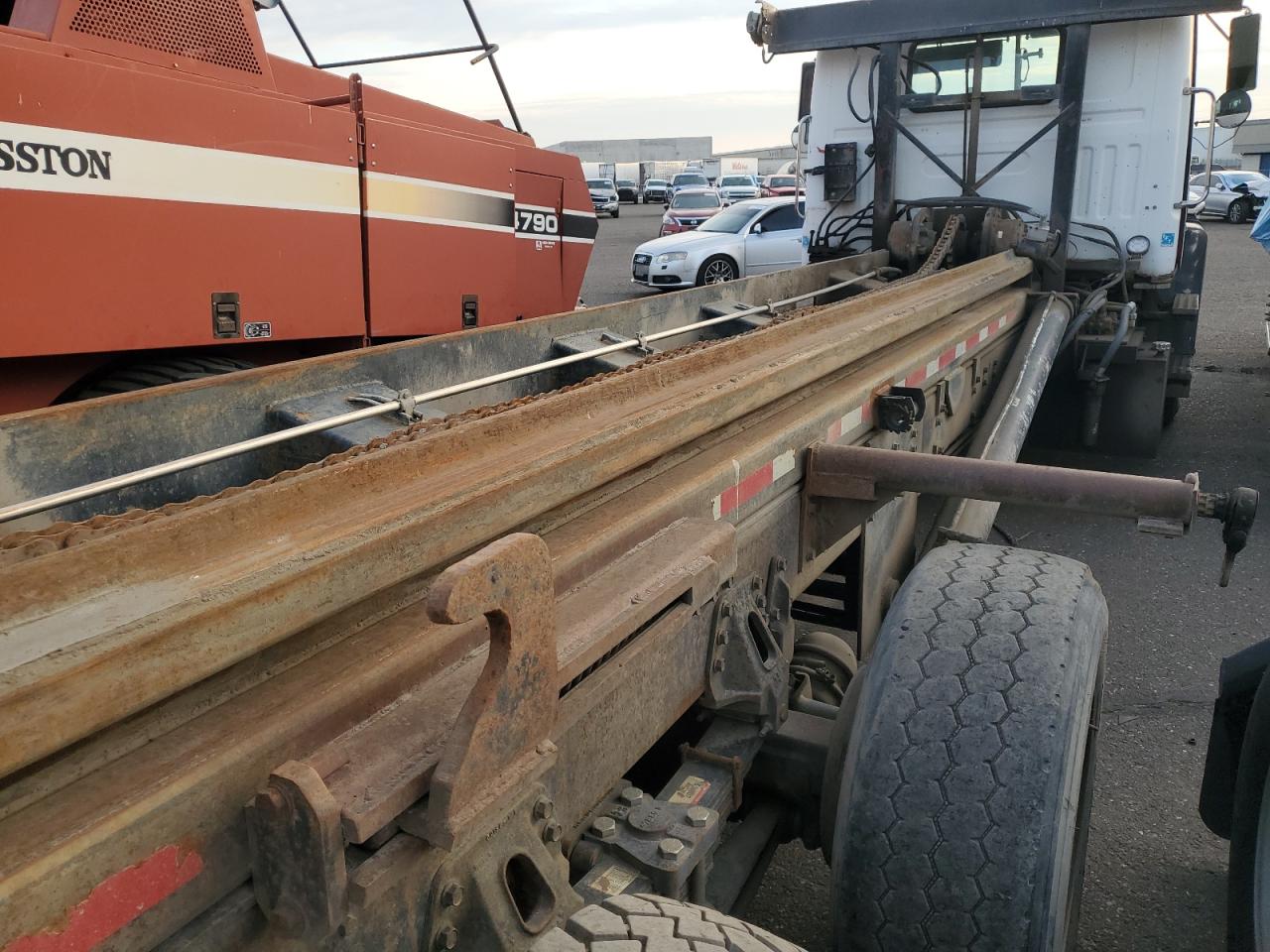 1997 Volvo Roll-Off Container Truck VIN: 4VHJCLPFXVR856631 Lot: 90477735