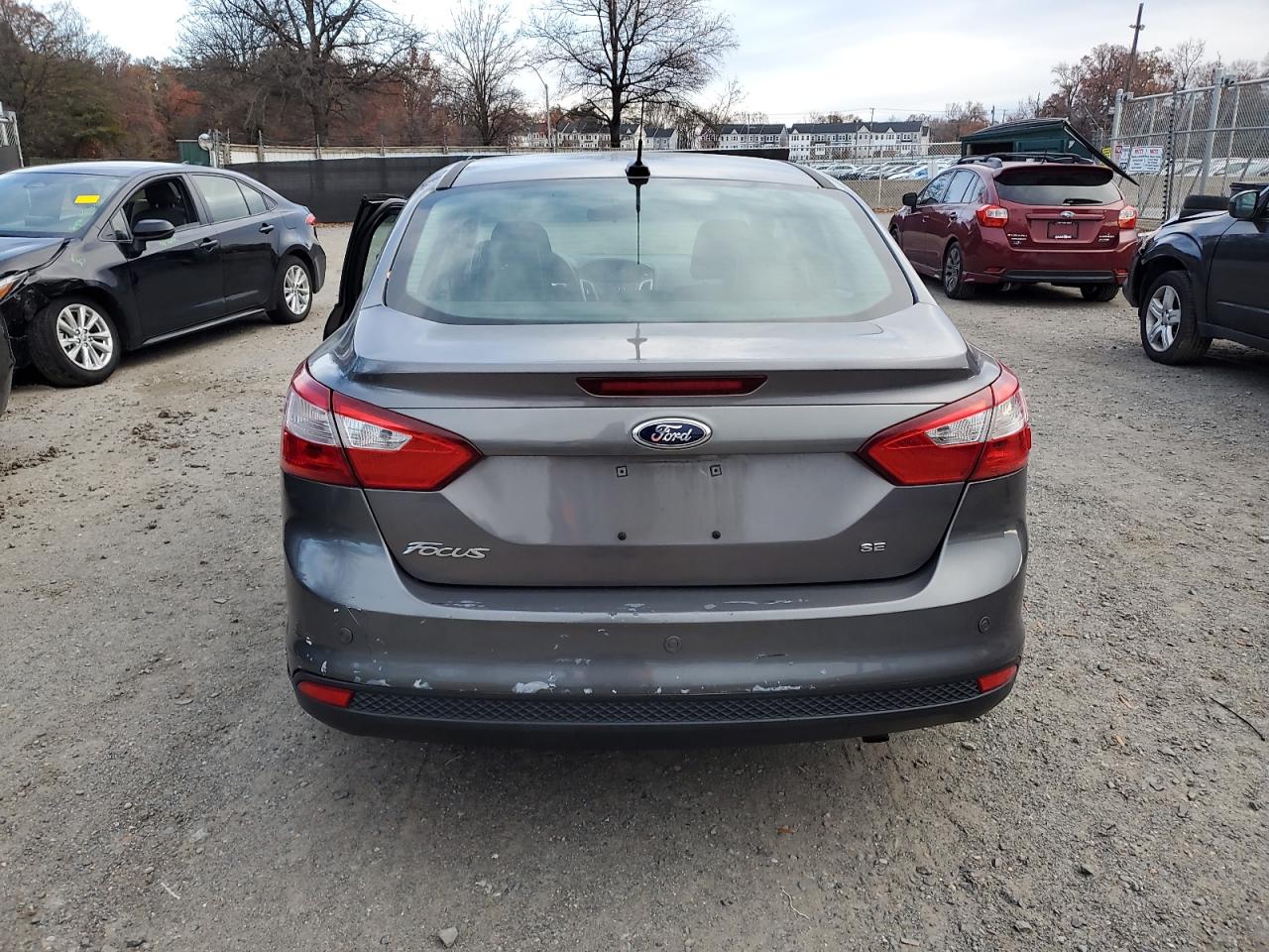 2014 Ford Focus Se VIN: 1FADP3F24EL410576 Lot: 92036275